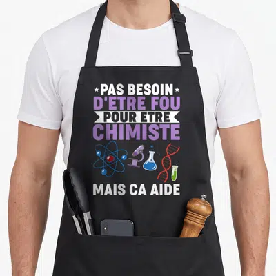 Tablier de cuisine noir avec inscription Pas besoin d'être fou pour être chimiste mais ça aide et illustrations scientifiques colorées.