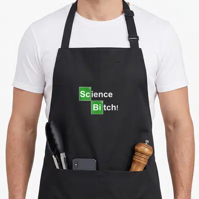 Tablier de cuisine noir avec l'inscription Science Bitch en carrés verts imitant un tableau périodique.