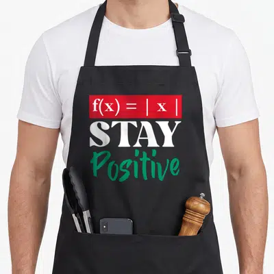 Tablier de cuisine noir avec l'équation f(x) = |x| et le texte Stay Positive en vert.