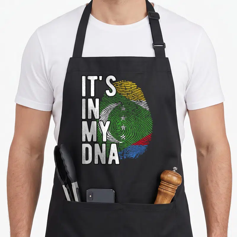 Tablier de cuisine noir avec inscription blanche It's in my DNA et empreinte digitale tricolore.