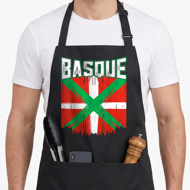 Tablier de cuisine noir avec drapeau Basque rouge vert blanc et texte Basque stylisé effet usé