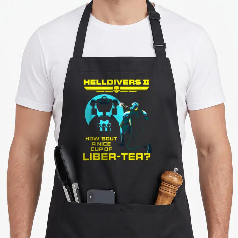 Tablier de cuisine noir avec soldat Helldivers II et texte jaune How 'bout a nice cup of liber-tea.