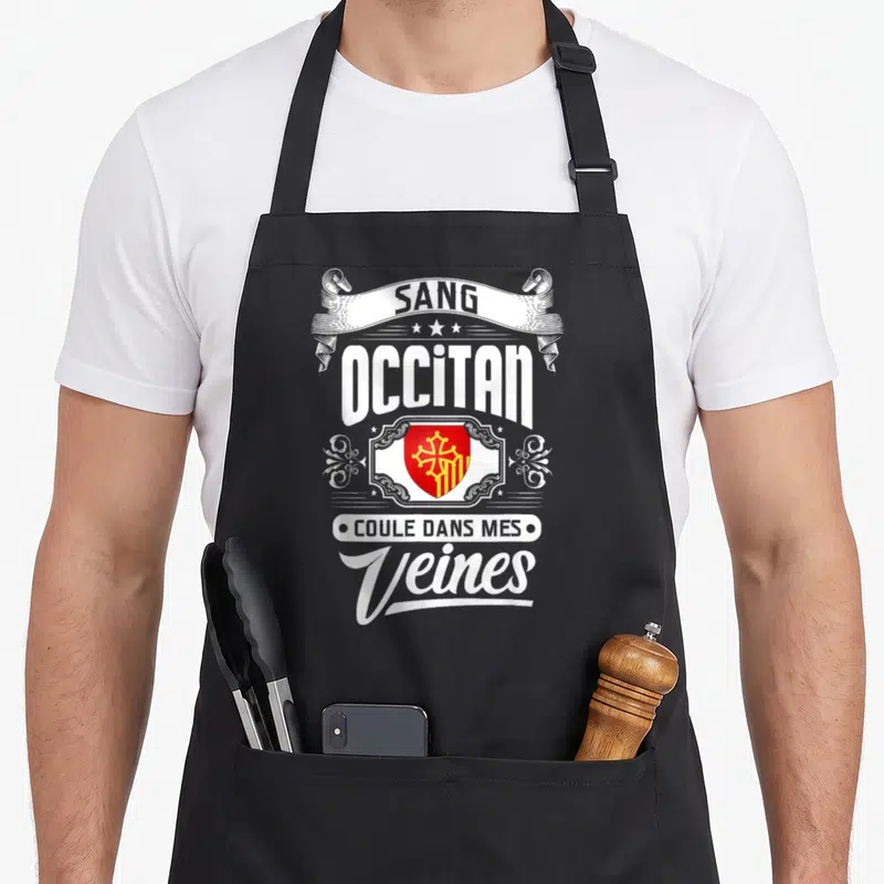 Tablier de cuisine noir avec inscription blanche et blason rouge et jaune représentant la fierté occitane.