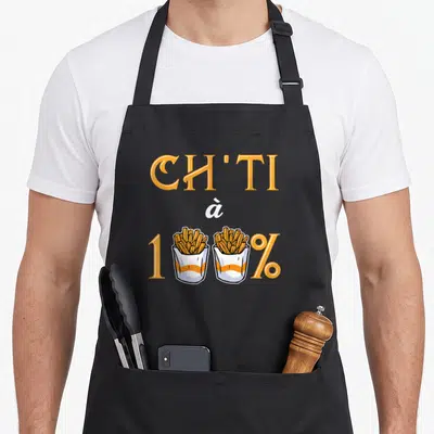 Tablier de cuisine noir avec inscription Ch'ti à 100% et deux sachets de frites dorées stylisés.