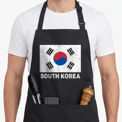 Tablier de cuisine noir avec drapeau Corée du Sud vintage et texte South Korea en bas.