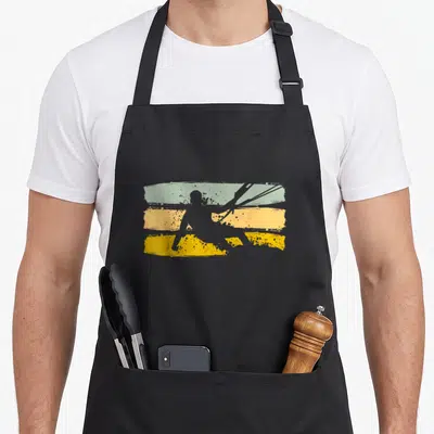 Tablier de cuisine noir avec silhouette kiten et bandes vertes jaunes vintage.