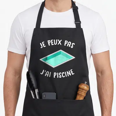 Tablier de cuisine noir avec illustration de piscine turquoise et texte blanc Je peux pas j'ai piscine