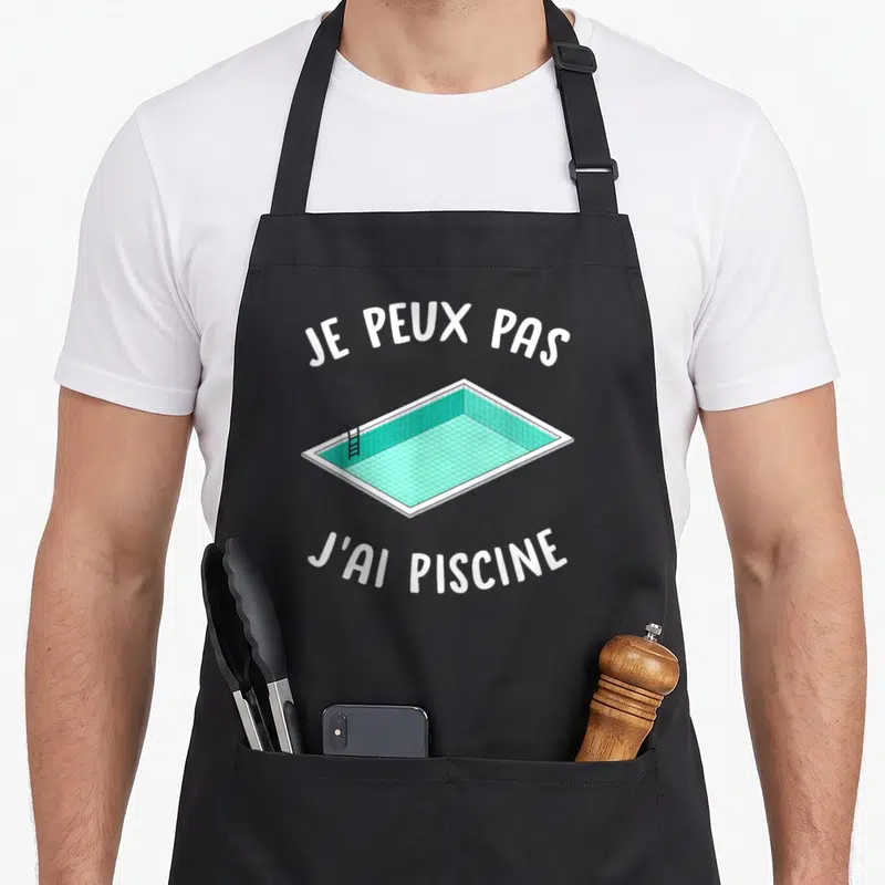 Tablier de cuisine noir avec illustration de piscine turquoise et texte blanc Je peux pas j'ai piscine