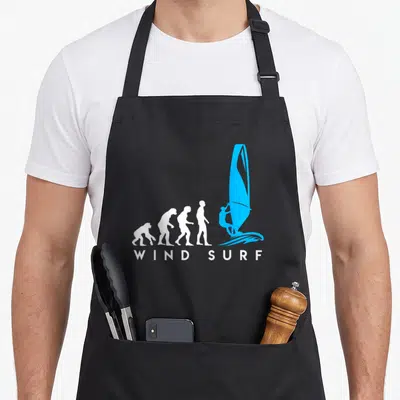 Tablier de cuisine noir avec illustration évolution humaine terminée par un windsurfeur bleu et texte Wind Surf en blanc.