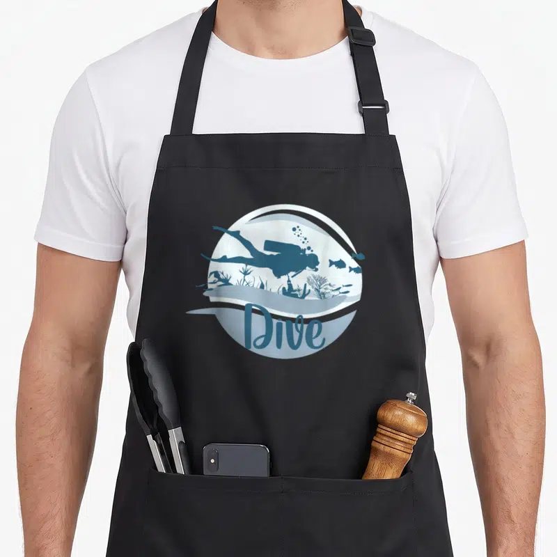 Tablier de cuisine noir avec illustration circulaire d'un plongeur et le mot Dive en bleu.