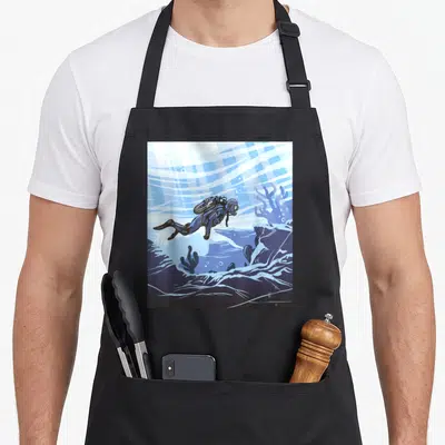 Tablier de cuisine noir avec illustration d'un plongeur sous-marin et des vagues stylisées en bleu et blanc.