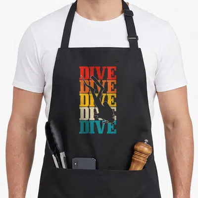 Tablier de cuisine noir avec motif DIVE en couleurs dégradées et silhouette de femme en plongée tête en bas.