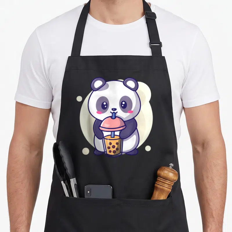 Tablier de cuisine noir avec illustration d'un panda mignon tenant une boisson boba bubble tea rose et marron.