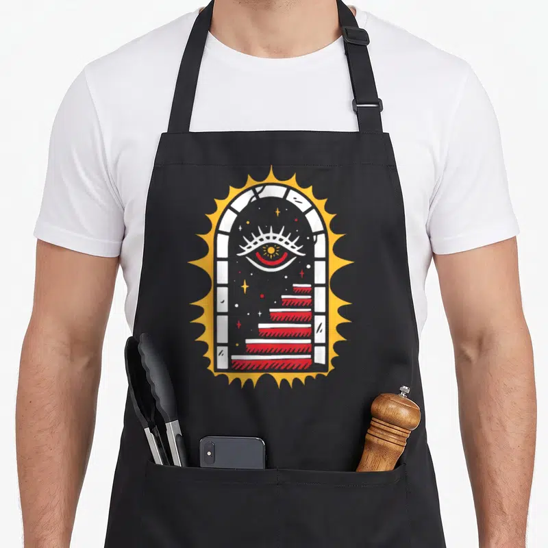 Tablier de cuisine noir avec illustration escalier œil et encre style old school tatouage.