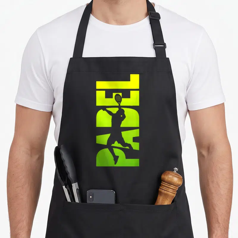 Tablier de cuisine noir avec silhouette joueur de padel et texte PADEL vert fluo stylisé.