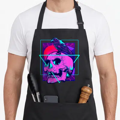 Tablier de cuisine noir avec un crâne rose vif surmonté d'un corbeau bleu cyan en style rétro-futuriste.