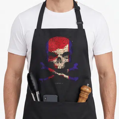 Tablier de cuisine noir avec un crâne et des os croisés aux couleurs du drapeau cambodgien et le mot Cambodia en bas.