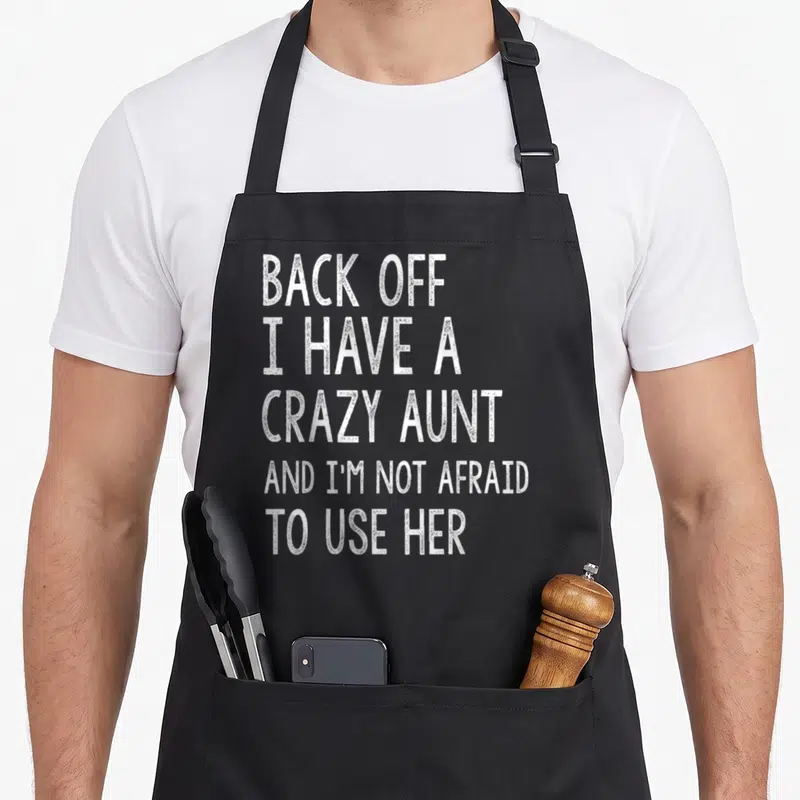 Tablier de cuisine noir avec texte blanc Back off I have a crazy aunt and I'm not afraid to use her