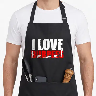 Tablier de cuisine noir avec l'inscription I Love Burpees en blanc et rouge accompagnée de silhouettes effectuant l'exercice.