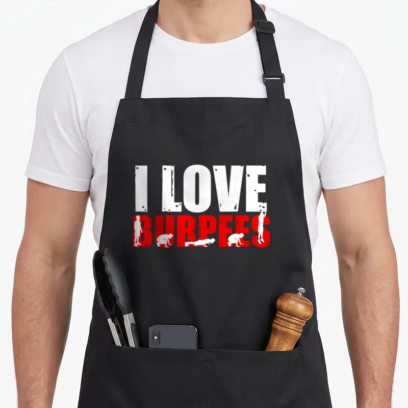 Tablier de cuisine noir avec l'inscription I Love Burpees en blanc et rouge accompagnée de silhouettes effectuant l'exercice.