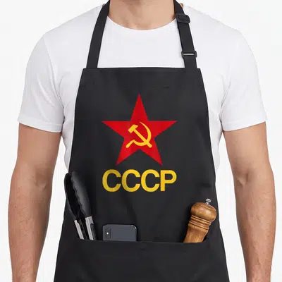 Tablier de cuisine noir avec étoile rouge et texte CCCP jaune en bas