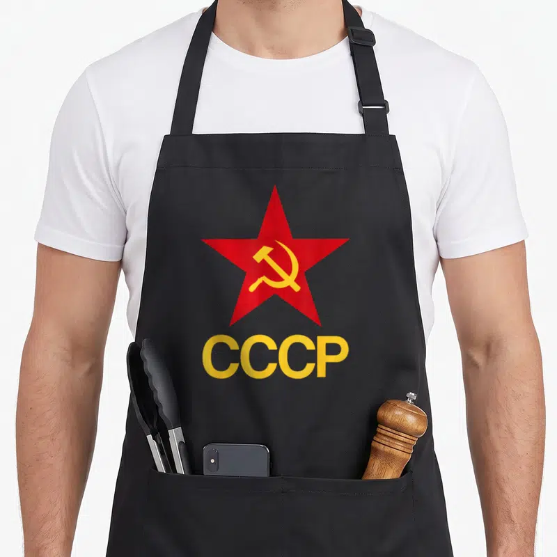 Tablier de cuisine noir avec étoile rouge et texte CCCP jaune en bas