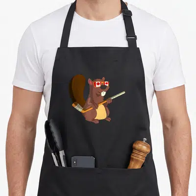 Tablier de cuisine noir avec un castor marron tenant une crosse de hockey et des lunettes au drapeau canadien.