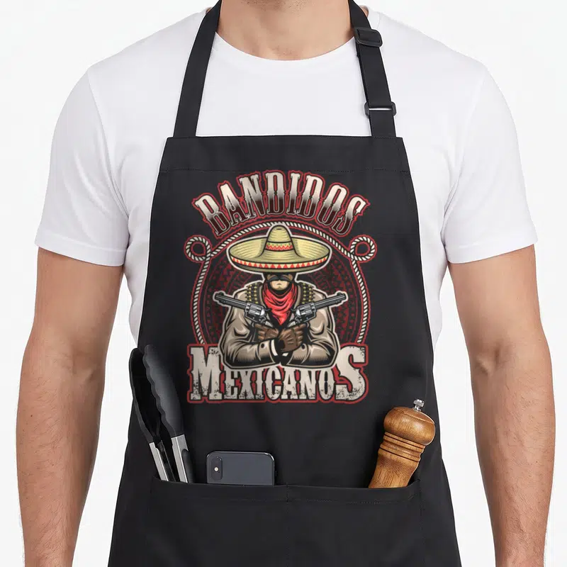 Tablier de cuisine noir avec illustration d'un bandit au sombrero,revolvers et texte Bandidos Mexicanos.
