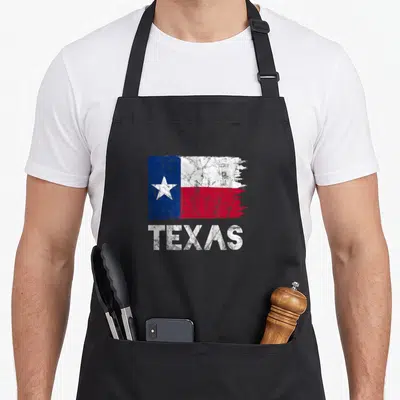 Tablier de cuisine noir avec drapeau vintage du Texas et inscription TEXAS en blanc
