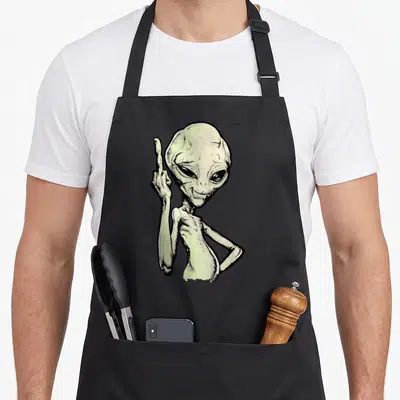 Tablier de cuisine noir avec un dessin d'extraterrestre gris levant fièrement le majeur en signe de mépris.