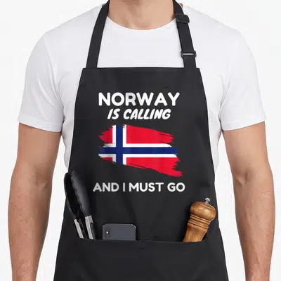 Tablier de cuisine noir avec drapeau norvégien stylisé et texte blanc Norway Is Calling And I Must Go.