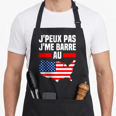 Tablier de cuisine noir avec inscription J'peux pas j'me barre au drapeau américain et silhouette des États-Unis.