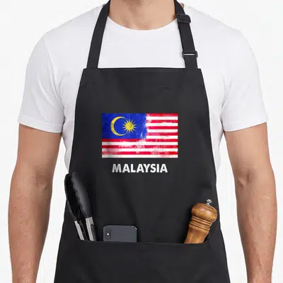 Tablier de cuisine noir avec drapeau de Malaisie et texte Malaysia en blanc sous l'illustration.