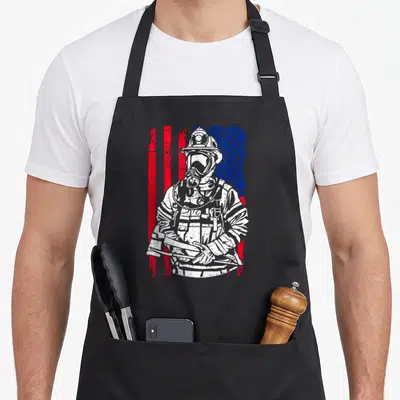 Tablier de cuisine noir avec illustration d'un pompier volontaire EMT sur fond de drapeau américain stylisé.