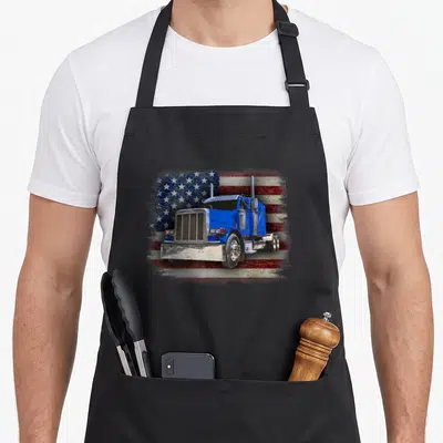 Tablier de cuisine noir avec illustration d'un camion bleu Big Rig sur fond de drapeau américain délavé.