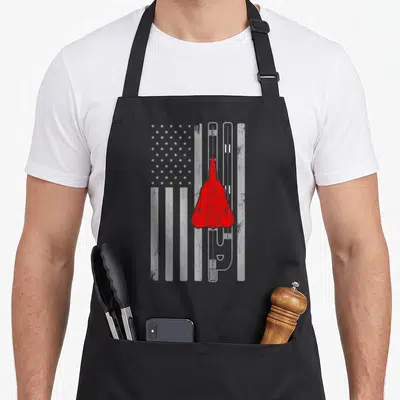 Tablier de cuisine noir avec avion F-14 Tomcat rouge sur drapeau américain en gris et blanc.