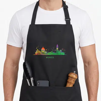 Tablier de cuisine noir avec un paysage urbain coloré de Venise et le texte VENICE en bas.