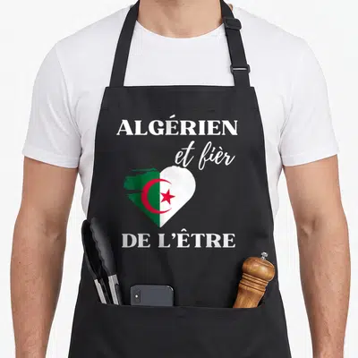 Tablier de cuisine noir avec un cœur stylisé aux couleurs du drapeau algérien et texte blanc