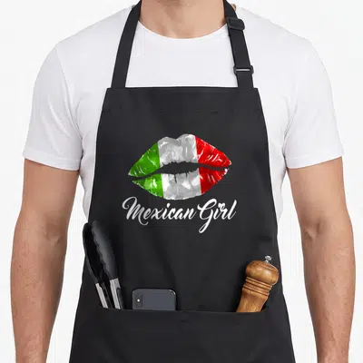 Tablier de cuisine noir avec empreinte de lèvres aux couleurs du Mexique et l'inscription Mexican Girl en blanc.