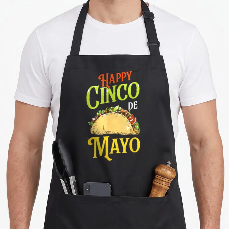 Tablier de cuisine noir avec illustration de taco et texte Happy Cinco De Mayo Mayo en couleurs vives.