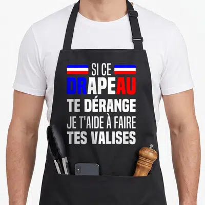 Tablier de cuisine noir avec inscription blanche et drapeau tricolore en haut du motif imprimé.