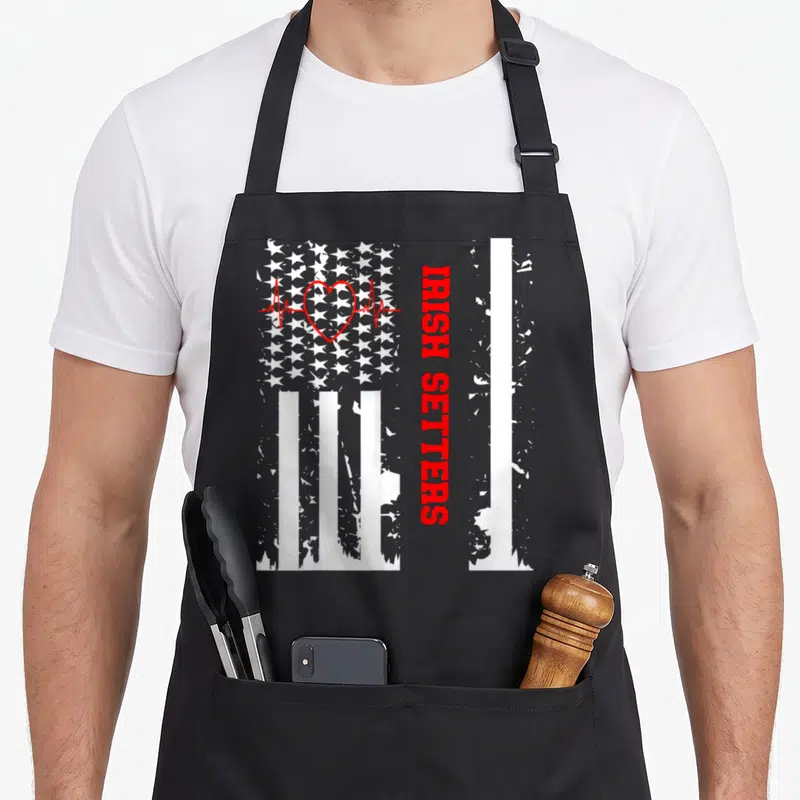 Tablier de cuisine noir avec drapeau américain délavé, cœur rouge et inscription Irish Setters verticale.