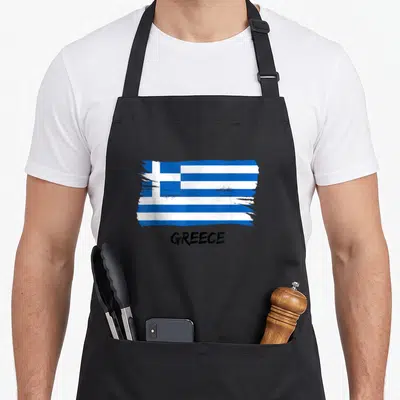 Tablier de cuisine noir avec drapeau de la Grèce en bleu et blanc et le mot Greece écrit en noir.