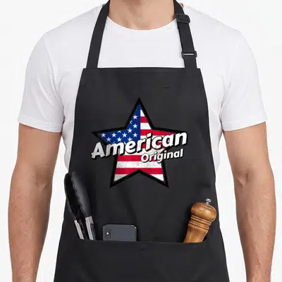 Tablier de cuisine noir avec une grande étoile aux couleurs du drapeau américain et le texte American Original en blanc.