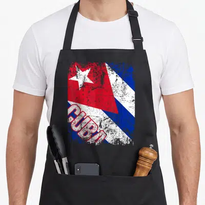 Tablier de cuisine noir avec le drapeau de Cuba et le mot CUBA en lettres rouges délavées