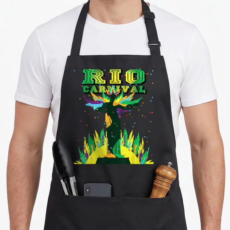 Tablier de cuisine noir avec une illustration du Cristo Redentor et les mots RIO CARNIVAL en lettres vertes et jaunes.