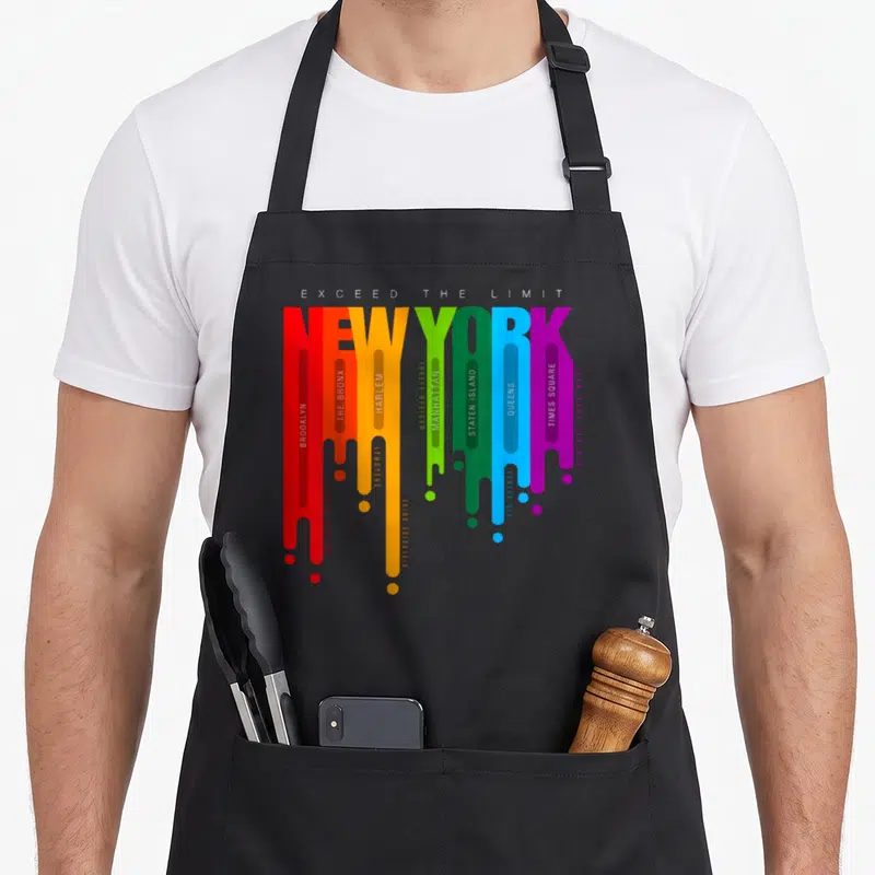Tablier de cuisine noir avec typographie colorée New York City et noms d'arrondissements.