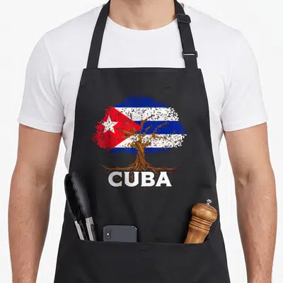 Tablier de cuisine noir avec un arbre dont le feuillage forme le drapeau Cuba Cubana et le mot CUBA en blanc sous les racines.