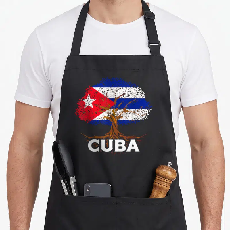 Tablier de cuisine noir avec un arbre dont le feuillage forme le drapeau Cuba Cubana et le mot CUBA en blanc sous les racines.