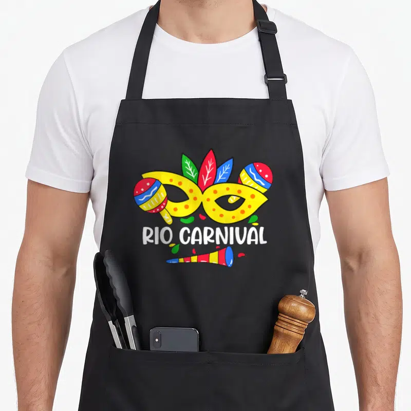 Tablier de cuisine noir avec masque jaune Rio Carnival, maracas et sifflet festif.